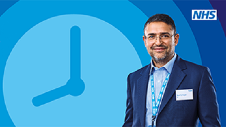 Doctor standing in front of a clock
